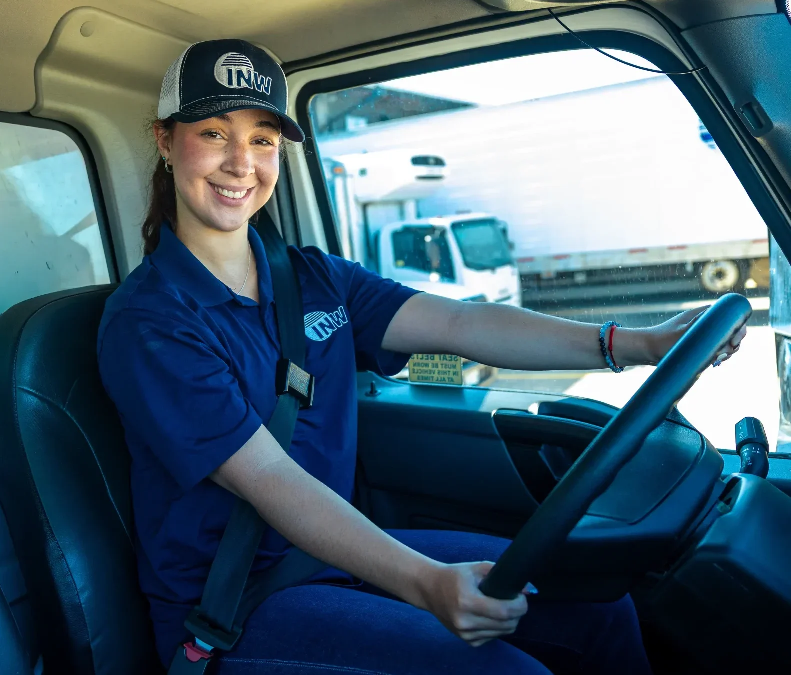 interior_truck_headshot_woman Woman driving truck and smiling.